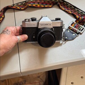 Yashica TL-Electro Black and Silver Camera with Patterned Strap